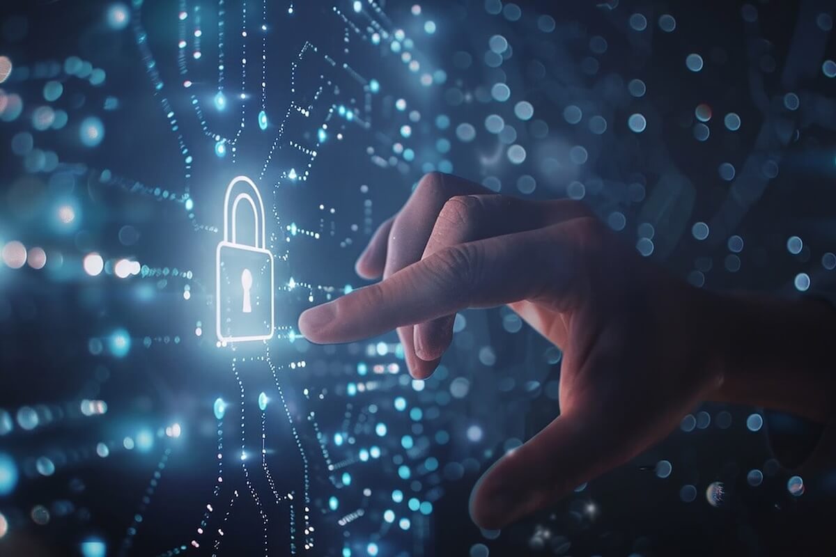 A closeup of a hand pressing a picture of a lock lit up in white.